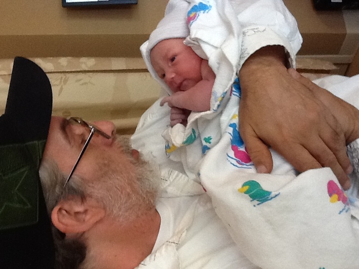 My dad meeting his first grand daughter