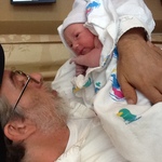 My dad meeting his first grand daughter