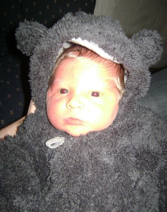 Fabian 4days old in his teddy bear suit