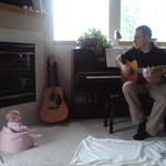Sitting and listening to Daddy play guitar