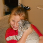 my lil girl and our cat carli on christmas morning...