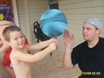 Corey and Uncle Mark, he's spinning a basketball on a pen!
