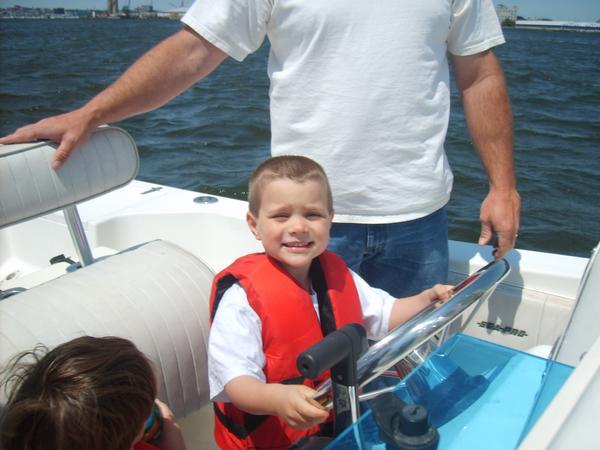 The oldest, Corey. Driving granddads boat