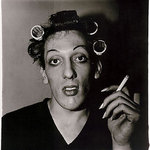 Diane Arbus: photo, A young man in curlers at home