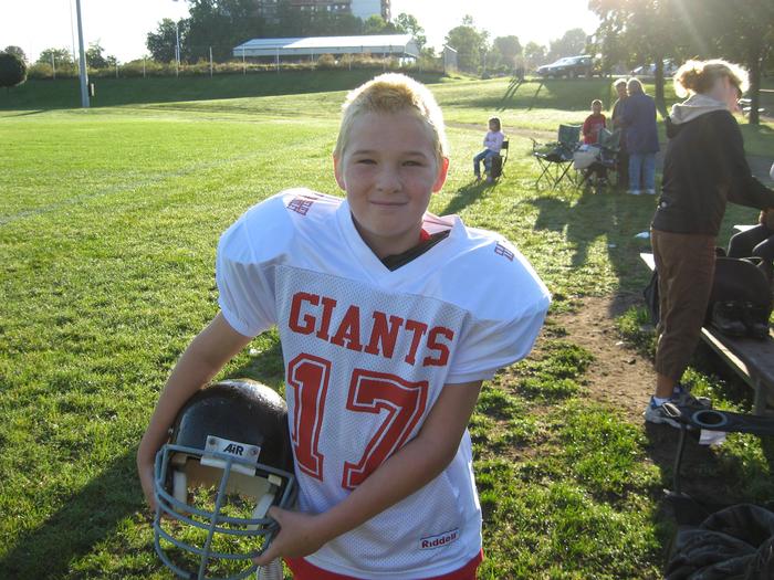 Alex with his blond hair at football