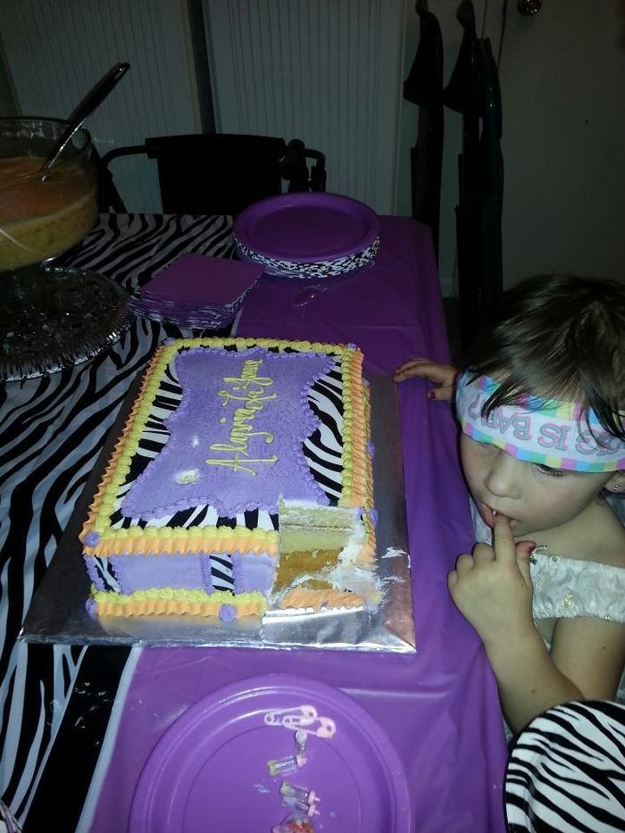 Hah my niece tasting the cake :P