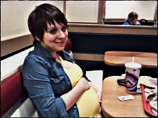 Huggin the bump :) while Daddy snaps a pic!