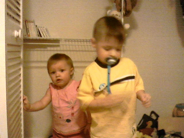 sarah and isaiah playing in the closet
