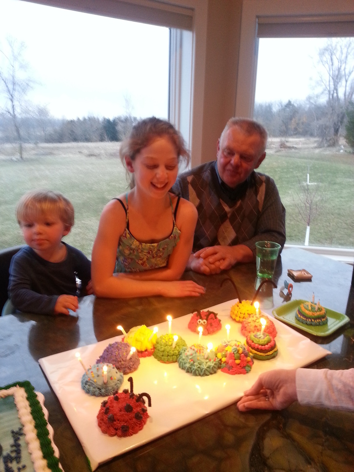 Kadens 2nd and Tailyns 12th bday- sitting next to grandpa
