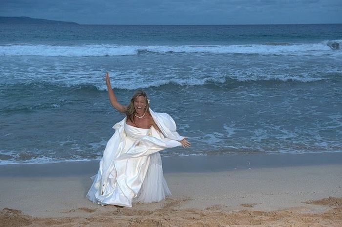 Post wedding ceremony cartwheel on Maui's beach