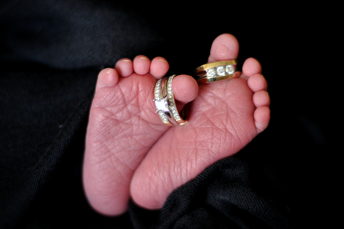 Xander's feet with our wedding rings
