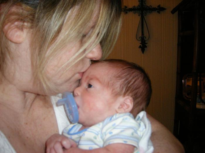 Mommy giving Henry some sugar! He's almost 6 pounds!