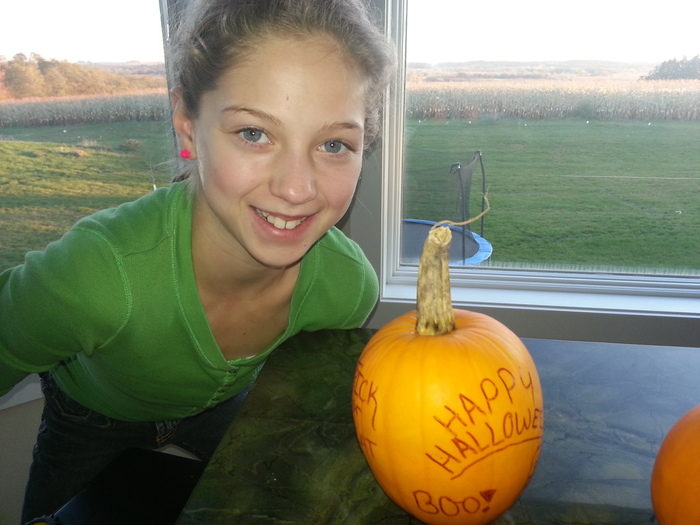 Big sister Tailyn with her pumpkin