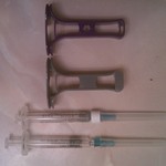 Avonex syringes and Avogrips, old and new