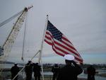 Once tied and docked the flag is raised, God Bless America and our troops ,bring them all home soon