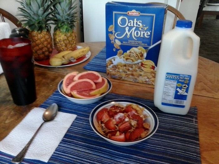 Another Typical Breakfast, Whole Oat Cereal w/ Strawberries, Non Fat Milk and a Sliced Grapefruit