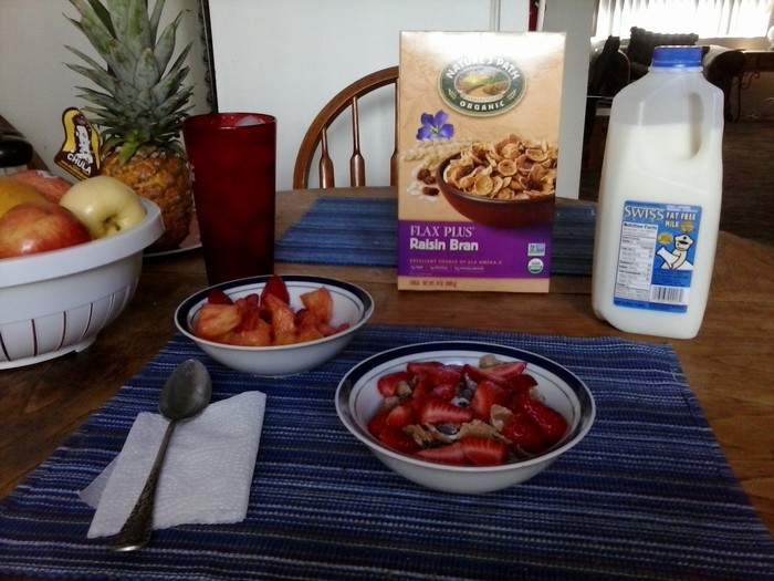 Typical Breakfast Raisin Bran & Strawberries, w/ Strawberries and Pineapple side 
