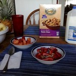 Typical Breakfast Raisin Bran & Strawberries, w/ Strawberries and Pineapple side 