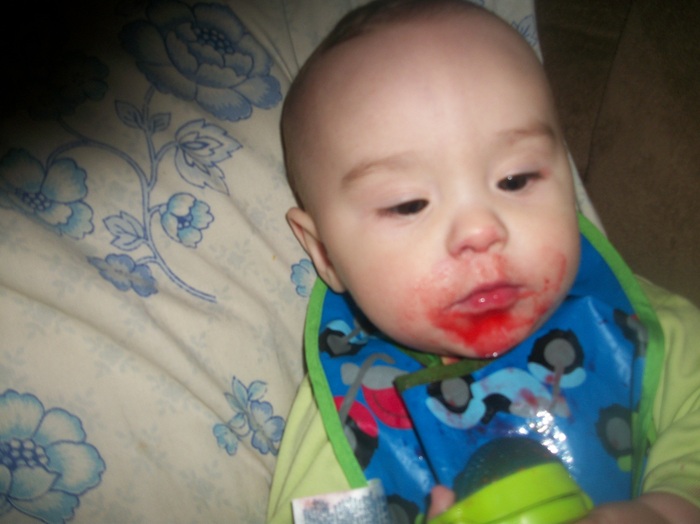 Jack eating frozen fruit in his mesh teether, 7 months old 