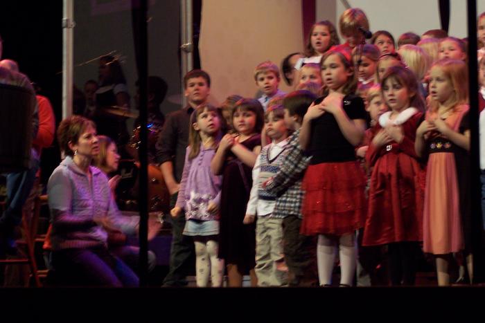Cass (Purple in front on left) at Church Christmas program - watching self on screen  :)