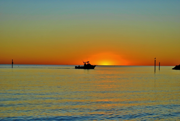 Fishing Boat Coming in After Sunset