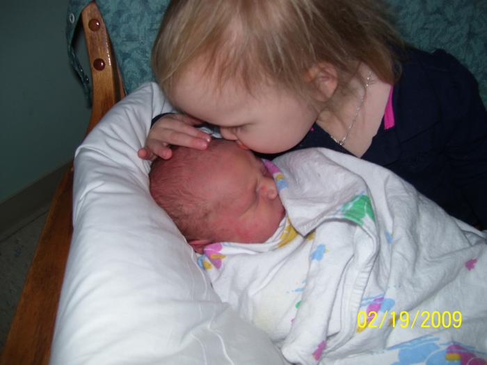 Hailie kissing her lil brother