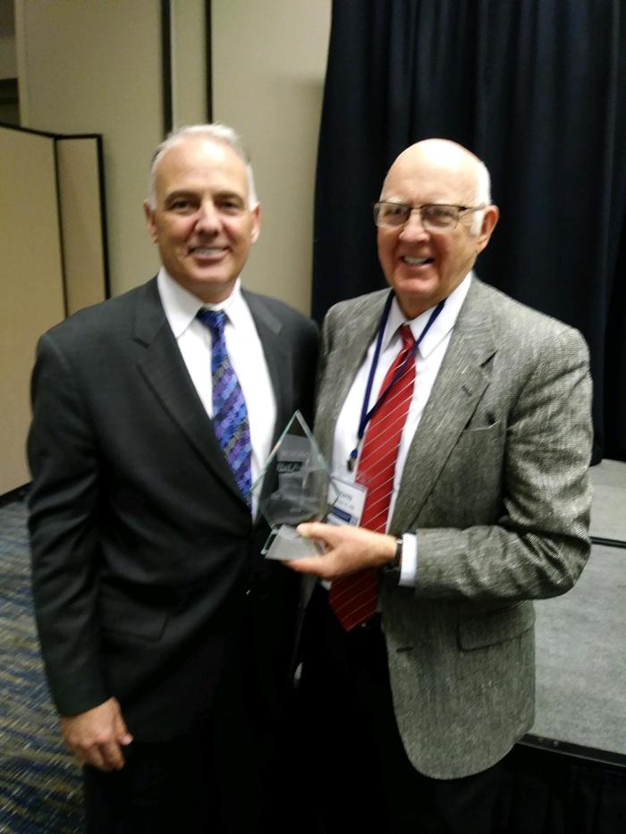 Dr. Hagan (R) receives Hal Foster Lifetime Achievement Award 2019 presented by John Doane MD 