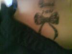 One of my Tattos dans name and a bow