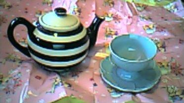 a tea pot and cup