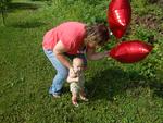 helping her let go of the balloons