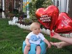 Gav Man holding Baby Coopers Balloons