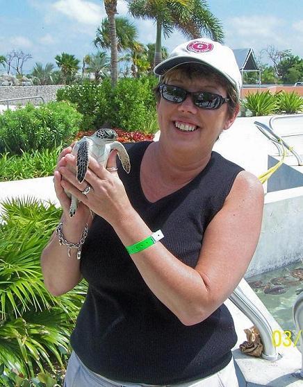 holding a turtle in the Grand Caymans